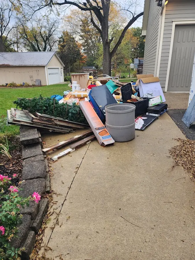Dumpster being loaded with debris for Commercial Dumpster Rental in Vernon